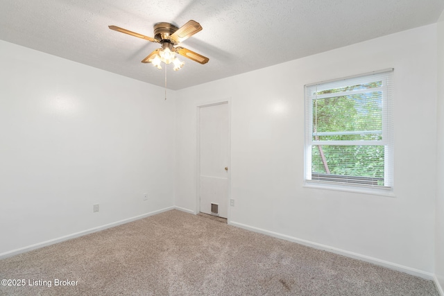 5612 Oakridge Pl, Louisville, KY 40229 - empty room featuring light colored carpet, a ceiling fan, baseboards, and a textured ceiling