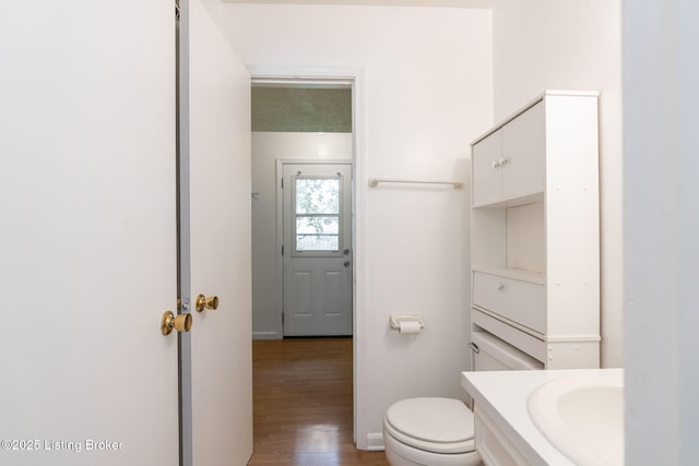 5612 Oakridge Pl, Louisville, KY 40229 - bathroom with toilet, wood finished floors, vanity, and baseboards