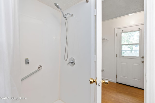 5612 Oakridge Pl, Louisville, KY 40229 - full bathroom featuring a shower, wood finished floors, and a textured ceiling