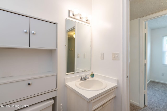 5612 Oakridge Pl, Louisville, KY 40229 - bathroom featuring vanity, a textured ceiling, and baseboards