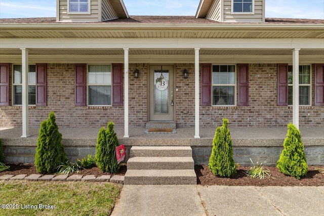238 Crossfield Dr, Mt Washington, KY 40047 - view of exterior entry featuring covered porch and brick siding
