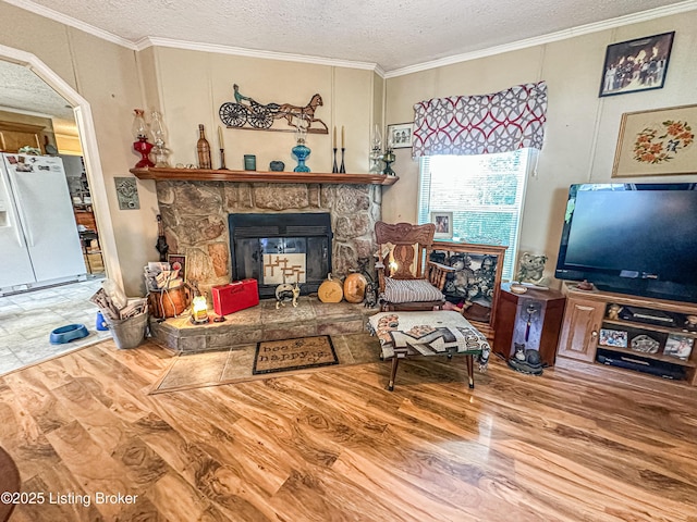 1073 Post-Tousey Rd Unit C, Caneyville, KY 42721 - living room with wood finished floors, a textured ceiling, crown molding, and a fireplace