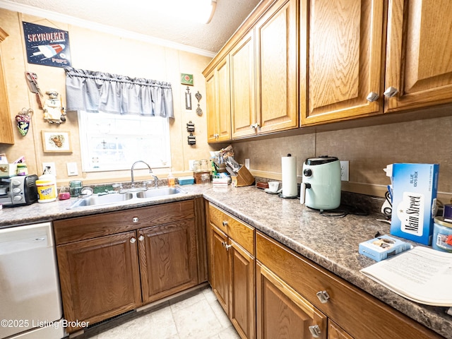 1073 Post-Tousey Rd Unit C, Caneyville, KY 42721 - kitchen featuring white dishwasher, a sink, ornamental molding, and brown cabinetry