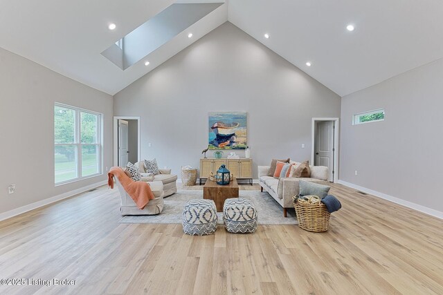 2519 Belknap Beach Rd, Prospect, KY 40059 - living area featuring high vaulted ceiling, recessed lighting, baseboards, wood finished floors, and a skylight