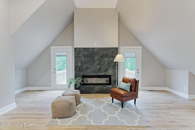 2519 Belknap Beach Rd, Prospect, KY 40059 - sitting room featuring wood finished floors, plenty of natural light, baseboards, and lofted ceiling