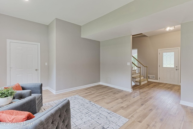 2519 Belknap Beach Rd, Prospect, KY 40059 - living area with stairway, light wood-type flooring, and baseboards