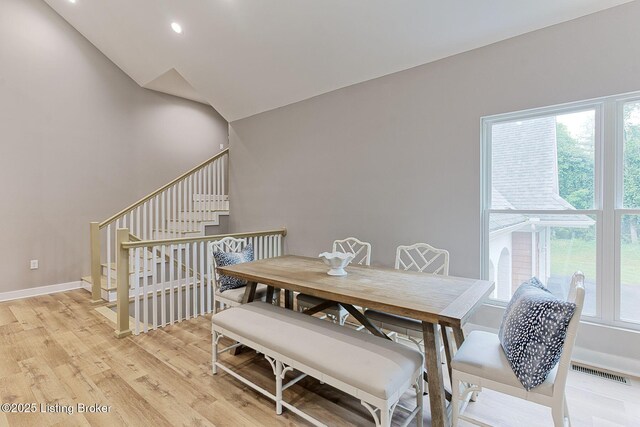 2519 Belknap Beach Rd, Prospect, KY 40059 - dining space featuring light wood finished floors, baseboards, recessed lighting, and stairway