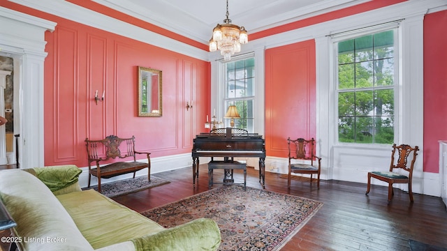 316 E Cross Main St, New Castle, KY 40050 - sitting room featuring a decorative wall, a chandelier, hardwood / wood-style flooring, and crown molding