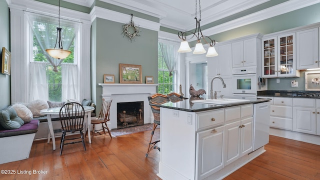 316 E Cross Main St, New Castle, KY 40050 - kitchen with a sink, white oven, dishwasher, ornamental molding, and white cabinetry