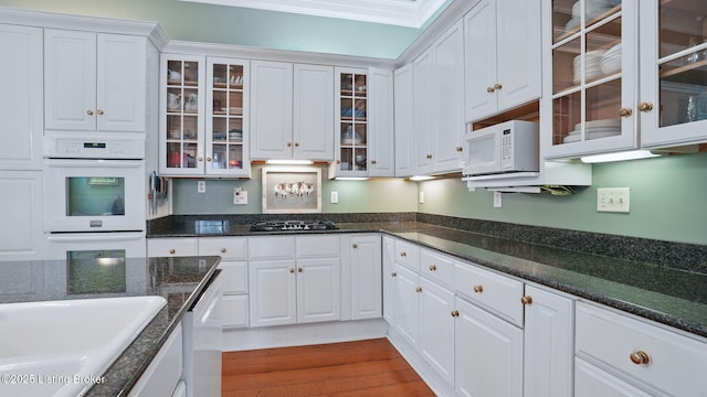316 E Cross Main St, New Castle, KY 40050 - kitchen with white appliances, white cabinets, glass insert cabinets, dark stone counters, and wood finished floors