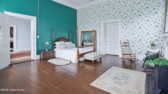 316 E Cross Main St, New Castle, KY 40050 - bedroom featuring wallpapered walls, crown molding, baseboards, hardwood / wood-style flooring, and an accent wall
