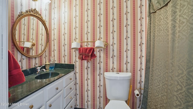 316 E Cross Main St, New Castle, KY 40050 - bathroom with wallpapered walls, vanity, and toilet