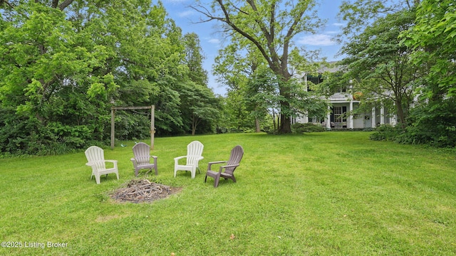 316 E Cross Main St, New Castle, KY 40050 - view of grassy yard featuring an outdoor fire pit