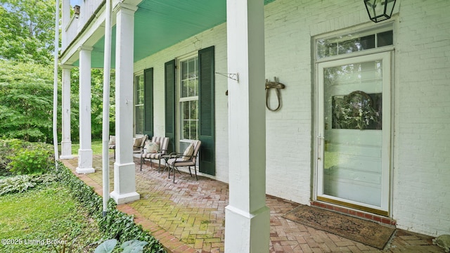 316 E Cross Main St, New Castle, KY 40050 - doorway to property featuring covered porch and brick siding