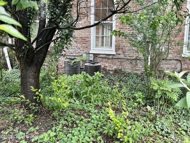 218 Locust St, Jeffersonville, IN 47130 - exterior view of brick siding and central air condition unit