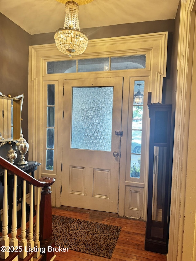 218 Locust St, Jeffersonville, IN 47130 - foyer with wood finished floors and a chandelier