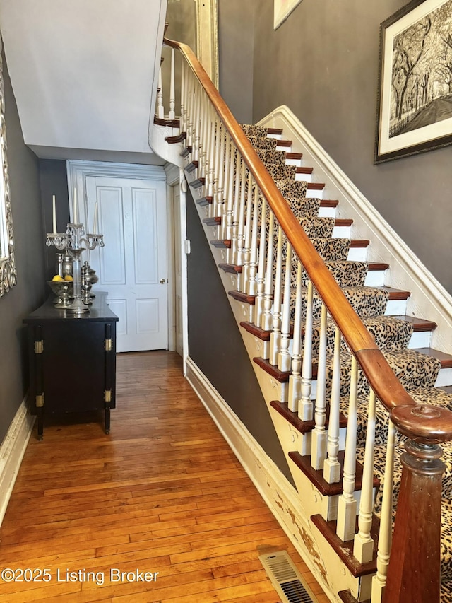 218 Locust St, Jeffersonville, IN 47130 - stairway with hardwood / wood-style flooring and baseboards