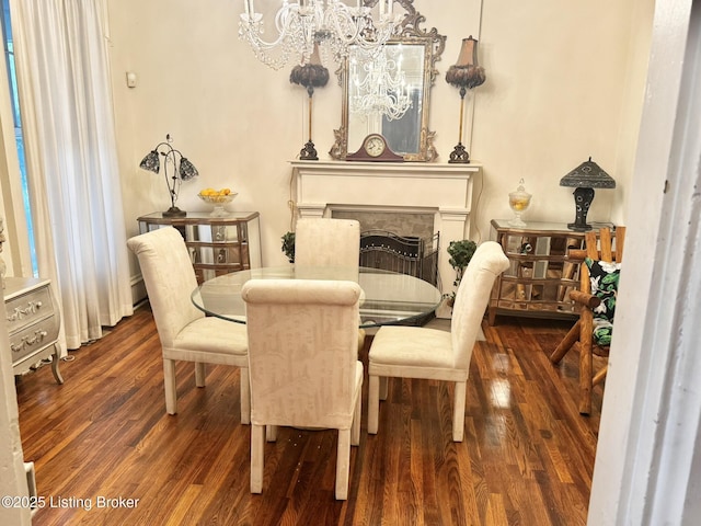 218 Locust St, Jeffersonville, IN 47130 - dining room with a chandelier, wood finished floors, and a fireplace
