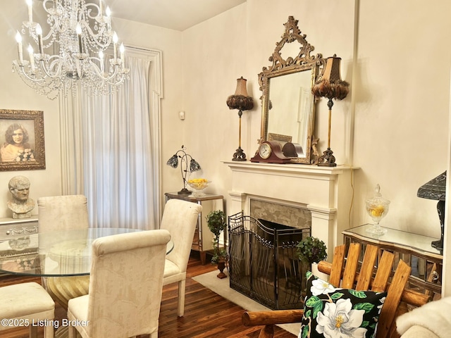 218 Locust St, Jeffersonville, IN 47130 - dining area featuring wood finished floors, a chandelier, and a fireplace with flush hearth