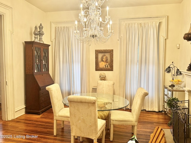 218 Locust St, Jeffersonville, IN 47130 - dining space with wood finished floors, a chandelier, and baseboards