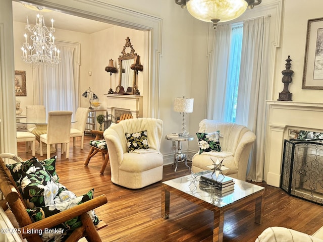 218 Locust St, Jeffersonville, IN 47130 - living room with a fireplace, a chandelier, wood finished floors, and plenty of natural light