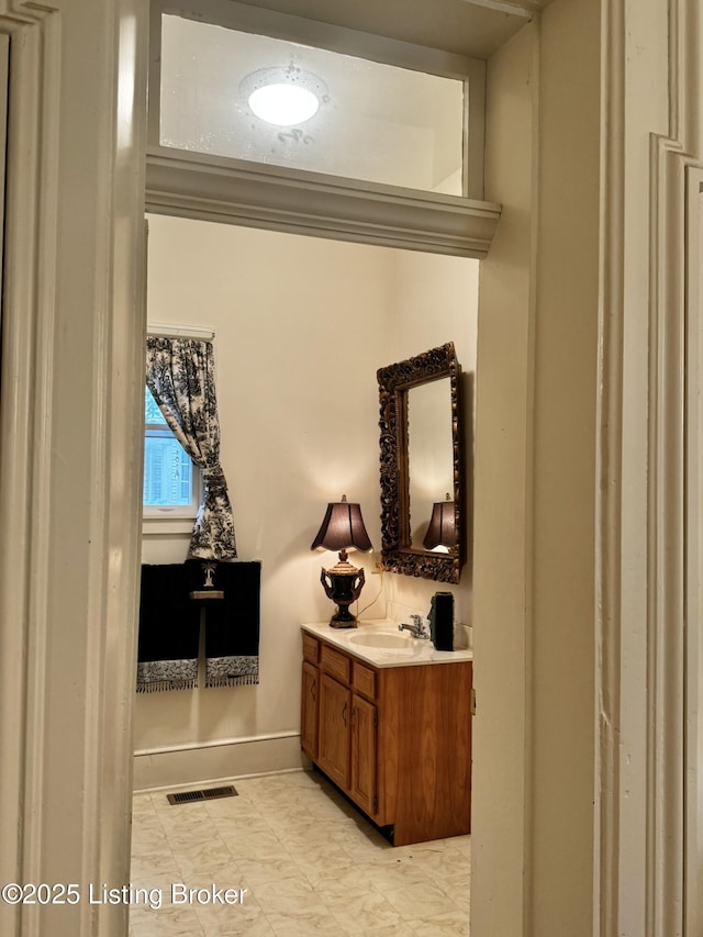 218 Locust St, Jeffersonville, IN 47130 - bathroom with vanity and baseboards