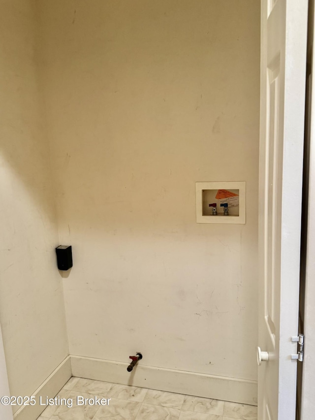 218 Locust St, Jeffersonville, IN 47130 - washroom with washer hookup, baseboards, and marble look tiles