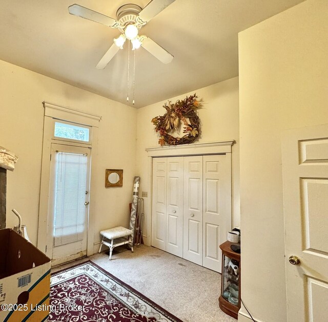 218 Locust St, Jeffersonville, IN 47130 - entryway featuring carpet flooring and a ceiling fan