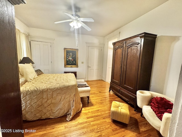 218 Locust St, Jeffersonville, IN 47130 - bedroom with light wood-type flooring and a ceiling fan