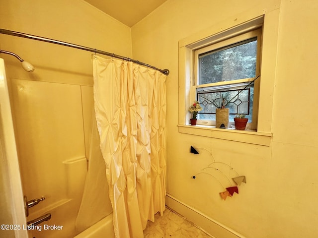 218 Locust St, Jeffersonville, IN 47130 - bathroom featuring shower / bath combo with shower curtain, marble finish flooring, and baseboards
