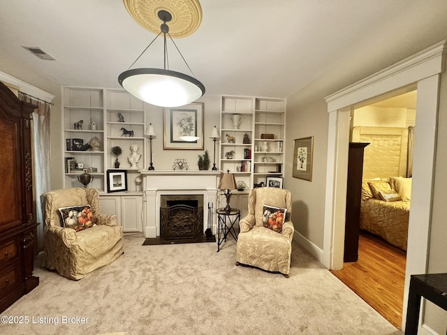 218 Locust St, Jeffersonville, IN 47130 - sitting room featuring a fireplace with flush hearth and carpet flooring