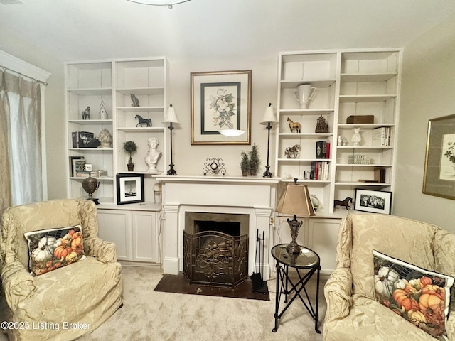 218 Locust St, Jeffersonville, IN 47130 - sitting room featuring built in features, carpet floors, and a fireplace with flush hearth