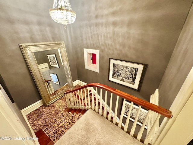 218 Locust St, Jeffersonville, IN 47130 - stairway with a chandelier and baseboards