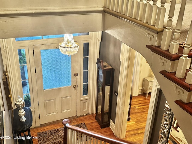 218 Locust St, Jeffersonville, IN 47130 - foyer with wood finished floors and a chandelier