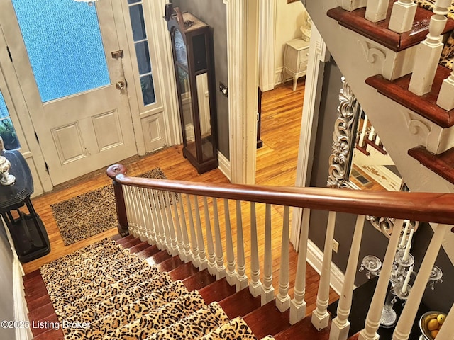 218 Locust St, Jeffersonville, IN 47130 - stairs with wood finished floors and baseboards