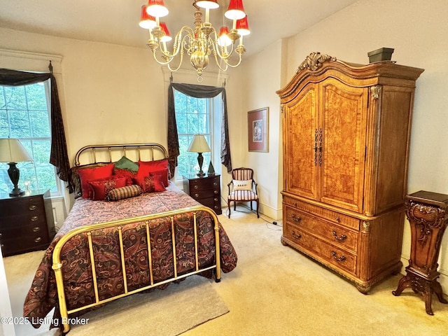 218 Locust St, Jeffersonville, IN 47130 - bedroom featuring light carpet and a chandelier
