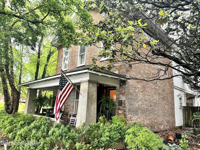 218 Locust St, Jeffersonville, IN 47130 - view of home's exterior featuring brick siding