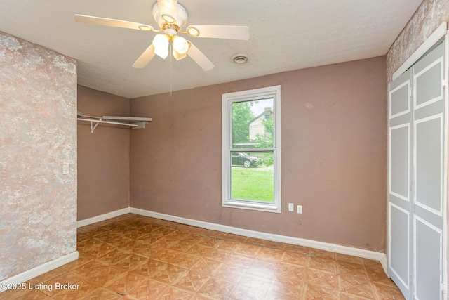 793 Samuels Loop, Coxs Creek, KY 40013 - unfurnished bedroom featuring baseboards, a closet, and a ceiling fan