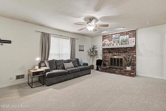 7020 Field View Ct, Louisville, KY 40291 - carpeted living room featuring ceiling fan, a brick fireplace, baseboards, and a textured ceiling
