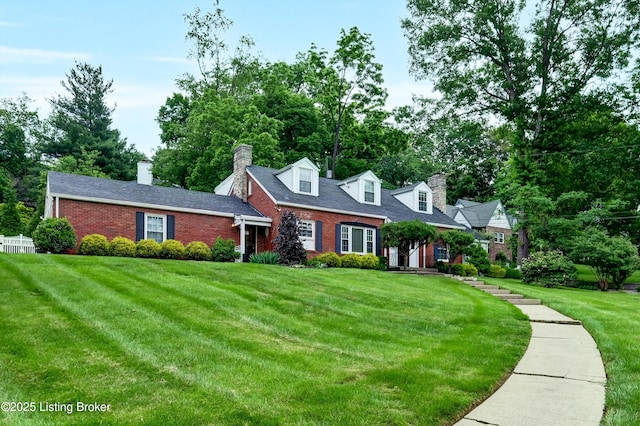 2501 Newburg Rd, Louisville, KY 40205 - cape cod-style house featuring brick siding, a front lawn, and a chimney