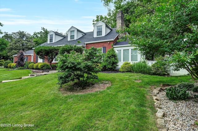 2501 Newburg Rd, Louisville, KY 40205 - cape cod-style house with brick siding, a front lawn, a chimney, and roof with shingles