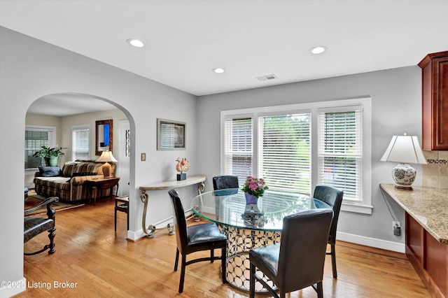2501 Newburg Rd, Louisville, KY 40205 - dining area featuring arched walkways, baseboards, light wood-style flooring, and recessed lighting