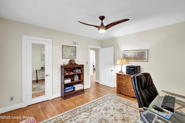 2501 Newburg Rd, Louisville, KY 40205 - office area featuring wood finished floors, baseboards, and a ceiling fan