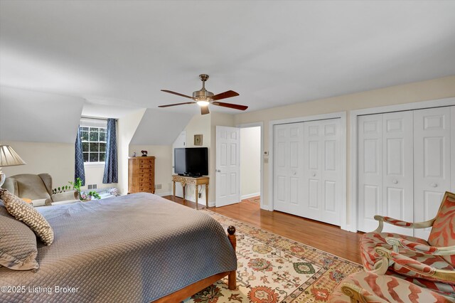 2501 Newburg Rd, Louisville, KY 40205 - bedroom with light wood-type flooring, two closets, a ceiling fan, and baseboards
