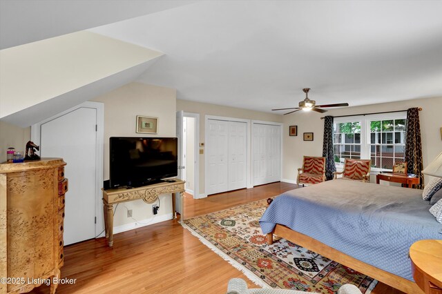 2501 Newburg Rd, Louisville, KY 40205 - bedroom featuring two closets, light wood finished floors, and ceiling fan