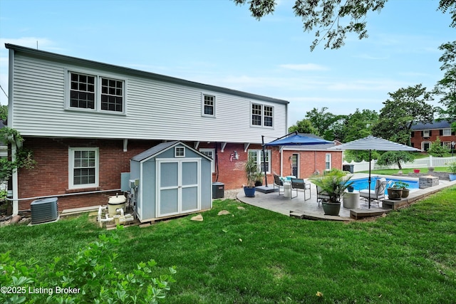 2501 Newburg Rd, Louisville, KY 40205 - back of property featuring brick siding, a patio area, and central AC unit