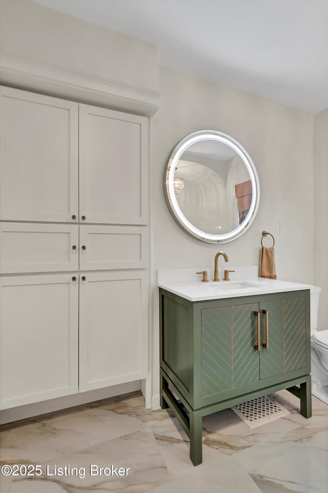 2501 Newburg Rd, Louisville, KY 40205 - bathroom featuring marble look tile flooring, vanity, and toilet