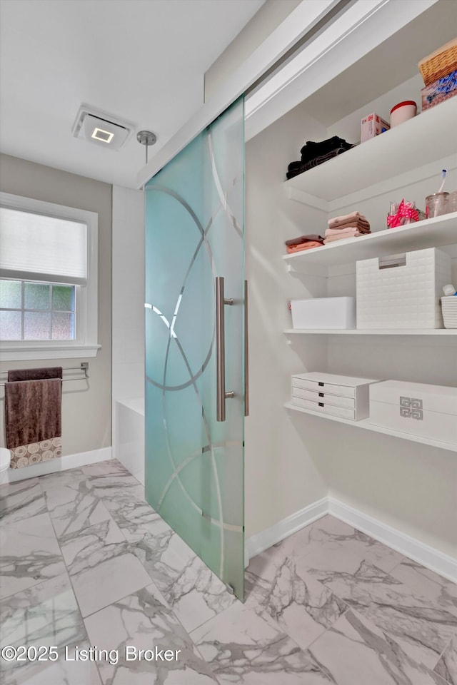 2501 Newburg Rd, Louisville, KY 40205 - bathroom with marble finish floors, baseboards, and a shower with shower door