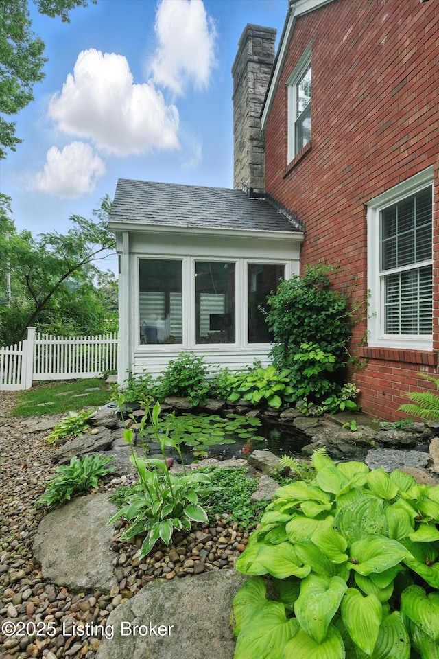 2501 Newburg Rd, Louisville, KY 40205 - view of home's exterior with a chimney and brick siding