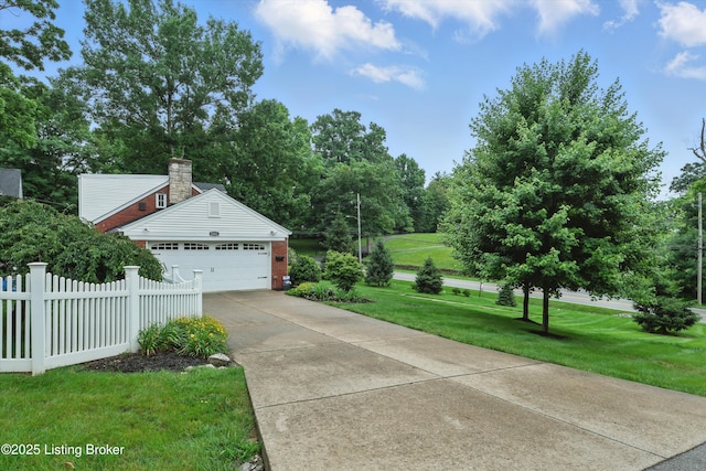2501 Newburg Rd, Louisville, KY 40205 - view of property exterior featuring brick siding, a chimney, concrete driveway, and a garage